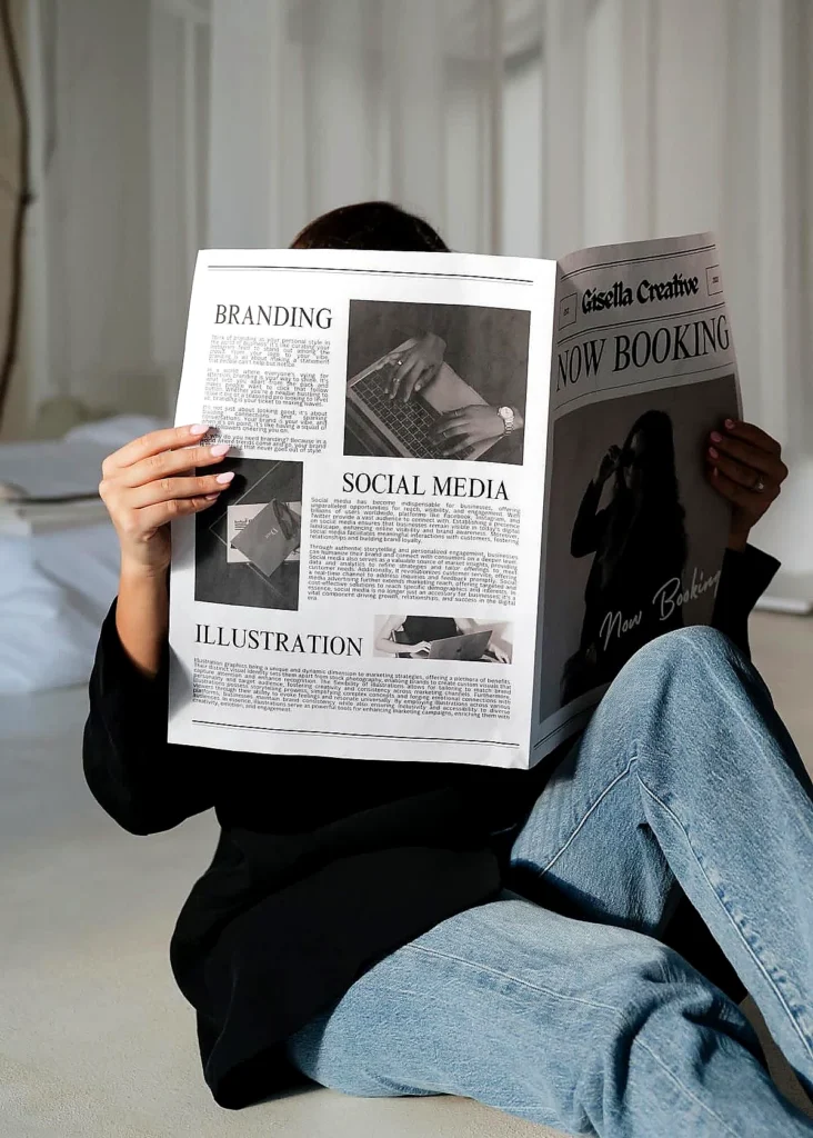 Woman holding a magazine about branding, social media, and media coverage