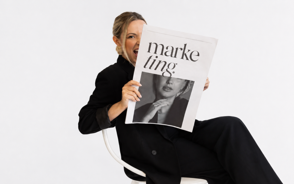Marketing professional holding an editorial publication representing traditional earned media